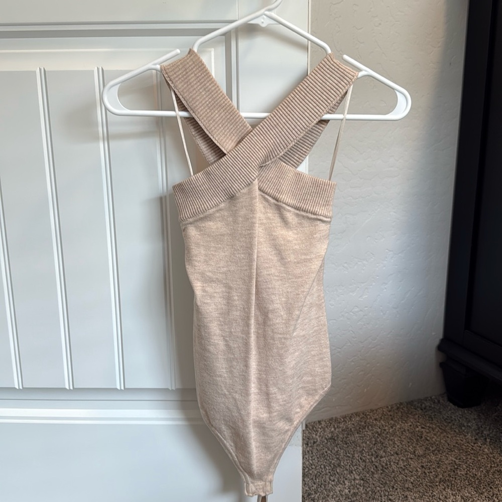 Tan colored crossed neck knit body suit